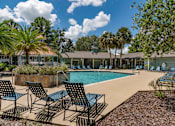 Thumbnail 17 of 43 - Community pool with lounge chairs  at Saddleworth Green, Florida