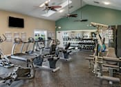 Thumbnail 22 of 43 - Fitness center with cardio and weight equipment at Saddleworth Green, Ocala, FL, 34474