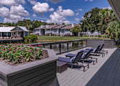 Thumbnail 4 of 43 - Sundeck with lounge chairs  at Saddleworth Green, Ocala, FL, 34474