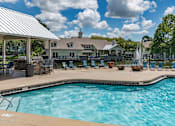 Thumbnail 3 of 43 - Community pool with covered lounge  at Saddleworth Green, Ocala, FL, 34474