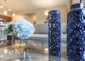 Thumbnail 19 of 50 - vases and flowers on coffee table at The Canyons at Linda Vista Trail, Oro Valley, Arizona