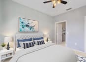Thumbnail 2 of 12 - a bedroom with a bed and a ceiling fan at Bella Vista on Park, Plant City, FL