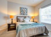 Thumbnail 6 of 14 - a bedroom with a bed and a large window at Thornberry Apartments, North Carolina, 28262
