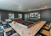 Thumbnail 14 of 49 - theater room with couches and bar seating at Monterey Ranch, Austin, Texas