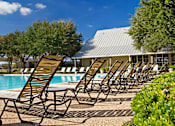 Thumbnail 49 of 49 - Pool with lounge chairs at Monterey Ranch, Texas, 78749