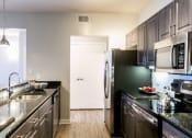 Thumbnail 16 of 41 - Kitchen  at The Park at Monterey Oaks, Austin, TX