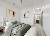 Thumbnail 27 of 27 - A bedroom with a large bed and two artworks on the wall.