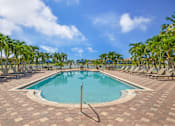 Thumbnail 10 of 29 - Resort-style swimming pool surrounded by lounge chairs
