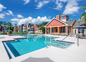 Thumbnail 15 of 38 - A large swimming pool in front of a house.
