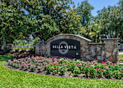 Thumbnail 37 of 38 - A sign that says Bella Vista in front of a green field.