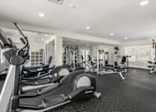 Thumbnail 13 of 30 - A well-equipped gym with a variety of machines and weightlifting equipment.