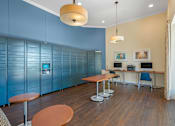 Thumbnail 28 of 32 - A room with a blue wall and a wooden table.
