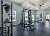 Thumbnail 23 of 32 - A spacious home gym with a variety of exercise equipment.