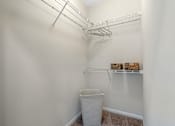 Thumbnail 19 of 32 - A Spacious Walk-In Closet with built in shelving