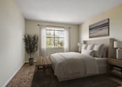 Thumbnail 18 of 32 - A bedroom with a large bed and a potted plant.