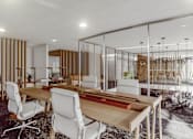 Thumbnail 16 of 27 - A modern dining room with a glass partition and a wooden table. at Element, Tampa, FL