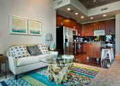 Thumbnail 11 of 27 - A modern living room with a white couch and a coffee table. at Element, Tampa, Florida