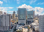 Thumbnail 44 of 48 - A cityscape with tall buildings and a clear sky.