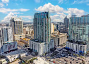 Thumbnail 43 of 48 - A cityscape with tall buildings and a clear sky.