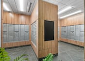 Thumbnail 40 of 48 - A mail room with multiple lockers