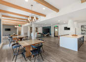 Thumbnail 26 of 49 - A modern dining room with a long table and chairs.