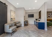 Thumbnail 31 of 49 - A living room with a grey sofa and a blue cabinet.