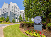 Thumbnail 49 of 49 - A sign for Emblem at 1000 in front of a building.
