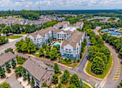 Thumbnail 46 of 49 - A bird's eye view of a residential area with apartment buildings and houses.