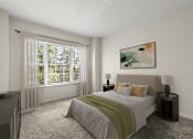 Thumbnail 10 of 34 - A bedroom with a large bed and a painting on the wall.