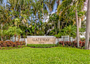 Thumbnail 30 of 33 - A sign that says Gateway Club in front of some trees.
