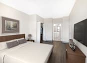 Thumbnail 2 of 26 - Large bedroom with a walk-in closet and en suite bathroom