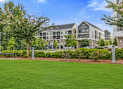 Thumbnail 37 of 42 - A grassy area in front of a building with the word "HAVEN" on it.