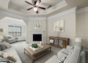 Thumbnail 1 of 38 - A living room with a grey couch, a coffee table, a fireplace, and a ceiling fan.