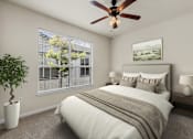 Thumbnail 7 of 38 - A bedroom with a bed, a ceiling fan, and a potted plant.