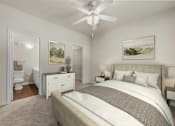 Thumbnail 4 of 38 - A bedroom with a large bed and a ceiling fan.