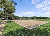 Thumbnail 22 of 38 - A baseball field with a white base and green grass.