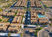 Thumbnail 28 of 29 - A large complex of houses with a roundabout in the middle.