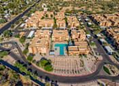 Thumbnail 29 of 29 - A bird's eye view of a residential area with a roundabout in the foreground.