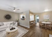 Thumbnail 2 of 37 - A living room with a white couch and a coffee table.