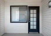 Thumbnail 13 of 37 - A black door is on the right and a white door is on the left.