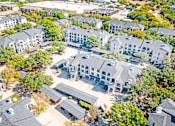Thumbnail 35 of 36 - A bird's eye view of a residential area with houses and trees.