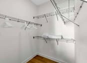 Thumbnail 14 of 27 - A white laundry room with a clothes drying rack and towel rack.