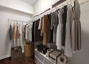 Thumbnail 6 of 28 - Spacious Walk-In Closet with built in shelving