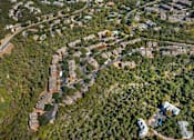 Thumbnail 6 of 27 - Top view of residential area surrounded by trees at Great Hills, Texas