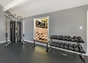 Thumbnail 9 of 27 - Gym room with a row of dumbbells at Great Hills, Austin, TX
