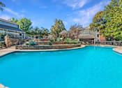 Thumbnail 11 of 27 - Large swimming pool in a backyard at Great Hills, Austin, TX 78759
