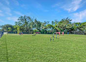 Thumbnail 16 of 27 - Grassy field with a playground at Great Hills, Austin, 78759
