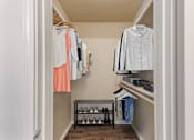 Thumbnail 20 of 27 - White closet with clothes hanging at Great Hills, Texas, 78759