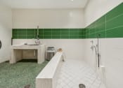 Thumbnail 26 of 34 - a white and green bathroom with a tub and a sink at The Merc, Waltham
