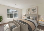 Thumbnail 35 of 40 - a bedroom with a bed and a chair and a window at Residences at Westborough Station, Massachusetts